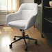 A white Martha Stewart swivel office chair with wheels.