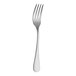 The handle of a RAK Youngstown Kampton stainless steel dinner fork with a white background.