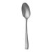 A close-up of a Sola stainless steel spoon with a silver handle.