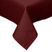 A burgundy Intedge square tablecloth with a folded edge on a table.