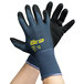 A pair of gray and purple Cordova ActivGrip Advance gloves with black palm coating on a white background.