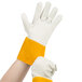 A pair of Cordova white and yellow leather welder's gloves with a yellow band.