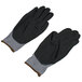 A pair of gray Cordova Conquest warehouse gloves with black foam nitrile/polyurethane palms and gray trim.