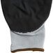 A pair of black and grey Cordova Cor-Touch foam gloves.