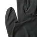 A close up of a Cordova black nylon glove with black foam nitrile coating on the palm.