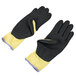 A pair of black and yellow Cordova ActivGrip Advance Kevlar gloves with black microfinish nitrile palms.