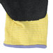 A pair of yellow and black knitted gloves.