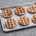 A metal tray with six Swapples vegan blueberry waffles.