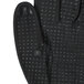A pair of black Cordova Conquest warehouse gloves with nitrile dots on the fingers.
