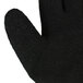 A close up of a Cordova Cold Snap small green warehouse glove with black foam latex coating on the palm.