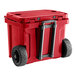 A red CaterGator outdoor cooler with black wheels.