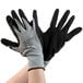 A pair of small Cordova gray nylon gloves with black foam nitrile palm coating on a white background.