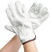 A pair of Cordova white leather gloves with a brown leather cuff.