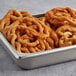 A metal tray of J & J Snack Foods funnel cakes.