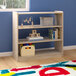 A Flash Furniture wooden open storage shelf with toys and boxes on the shelves in a room.