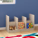 A Flash Furniture wooden storage unit with clear sides and 5 compartments holding toys.