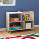 A Flash Furniture wooden mobile storage cart with clear bins on wheels filled with toys.