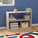 A Flash Furniture wooden open storage unit with two shelves holding toys and boxes.