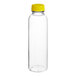 A clear plastic 16 oz. round juice bottle with a yellow cap.