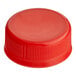 A red plastic cap for juice bottles.