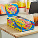A case of Swedish Fish Mini Soft and Chewy Candy pouches on a counter.