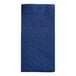 A navy blue Hoffmaster Quickset paper dinner napkin folded into a square with a pocket.