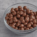 A bowl of Albanese Milk Chocolate Covered Brownie Bites.