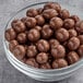 A bowl of Albanese milk chocolate covered pretzel balls.