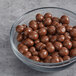 A bowl of Albanese Milk Chocolate Covered Cookie Dough Bites.