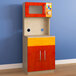A Flash Furniture wooden play kitchen storage cabinet with a microwave inside.