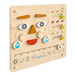 A wooden board with different faces and shapes on it.