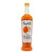 A bottle of Amoretti Tangelo Craft Puree with orange liquid inside.