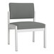 A grey Lesro Lenox fabric guest chair with white legs.