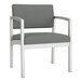 A grey Lesro Lenox guest chair with metal legs and arms.