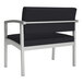 A Lesro Lenox bariatric guest arm chair with black vinyl seat and silver legs.