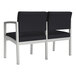A black Lesro Lenox Steel Loveseat with silver accents.