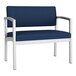 A Lesro Lenox bariatric guest arm chair with Imperial Blue vinyl and a white frame.