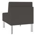 A close up of a Lesro Luxe Lounge Series Patriot Plus charcoal vinyl guest chair with steel legs.