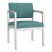 A blue Lesro Lenox guest chair with white legs and arms.