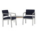 Two navy Lesro Lenox arm chairs with Sarum Twill laminate corner table.