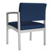 A navy blue Lesro Lenox guest chair with silver legs.