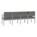 A row of Lesro Lenox steel and grey fabric 4-seat sofas with center arms.