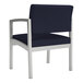 A navy blue Lesro Lenox guest arm chair with chrome legs.
