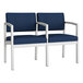 A pair of blue Lesro Lenox loveseats with a white frame.