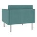 A teal Lesro Luxe Lounge Series Patriot Plus armchair with silver legs.