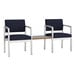 Two Lesro Lenox navy fabric arm chairs with a Sarum Twill laminate table connecting them.