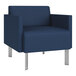 A Lesro Luxe Lounge Series blue vinyl guest armchair with steel legs.