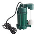 A green Zoeller M75 sump pump with a white cord.