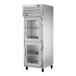 A silver True Spec Series reach-in refrigerator with glass half doors.
