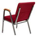 A Flash Furniture burgundy church chair with metal legs and wood accent arms.